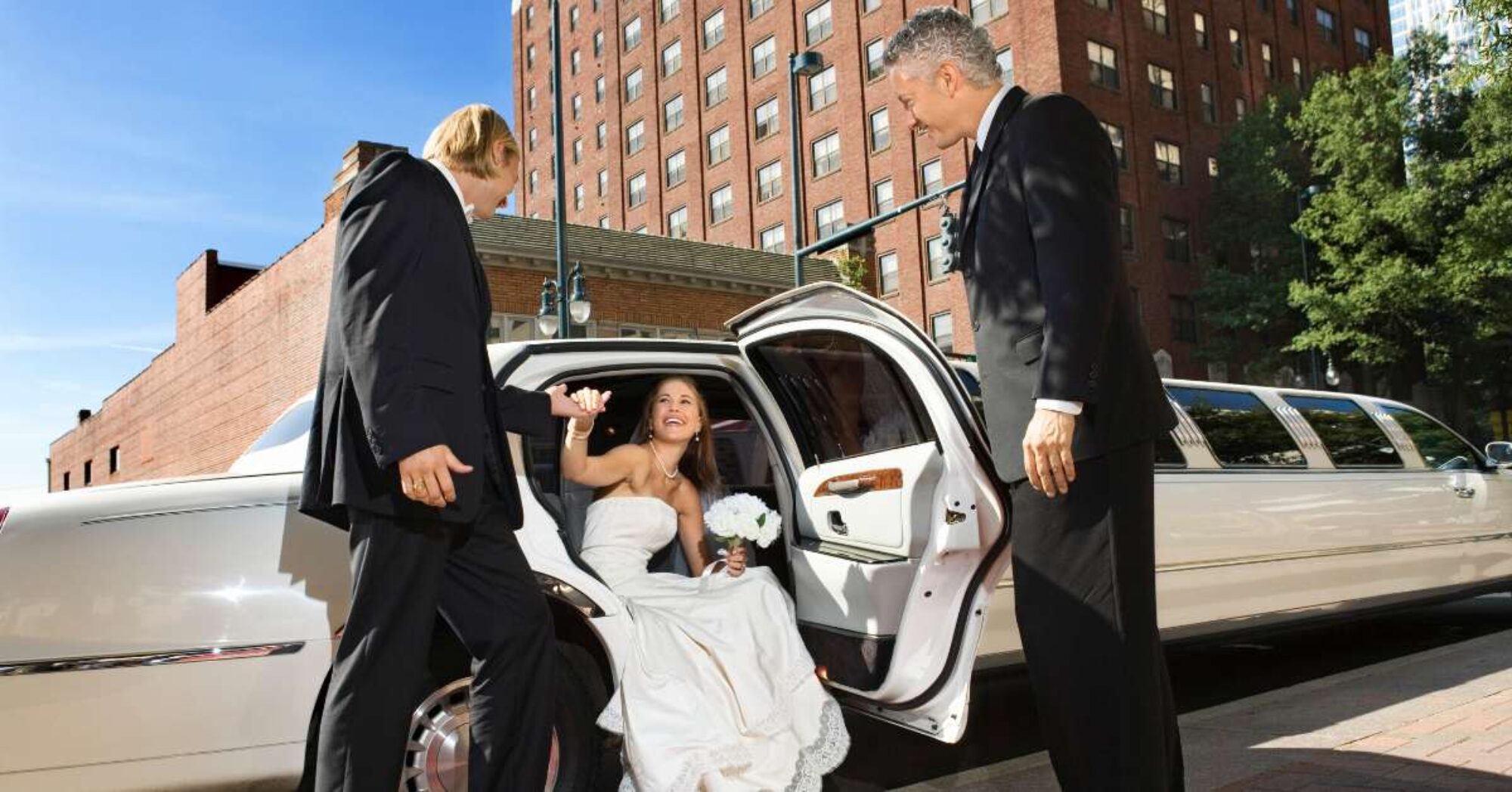 Bride leaving limousine